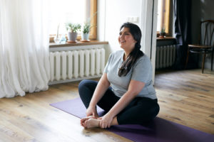 attractive young overweight woman in activewear choosing healthy lifestyle